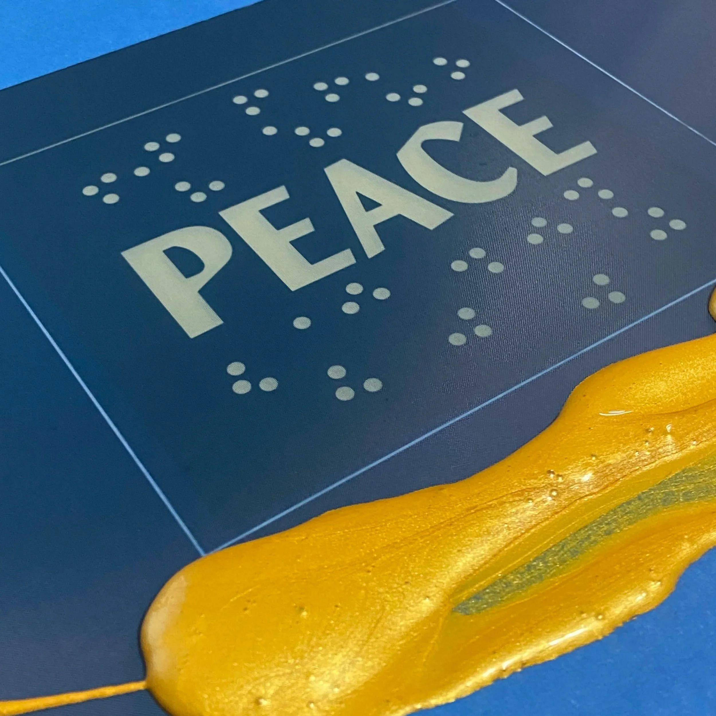 Printing process; gold ink before creating the first metallic layer