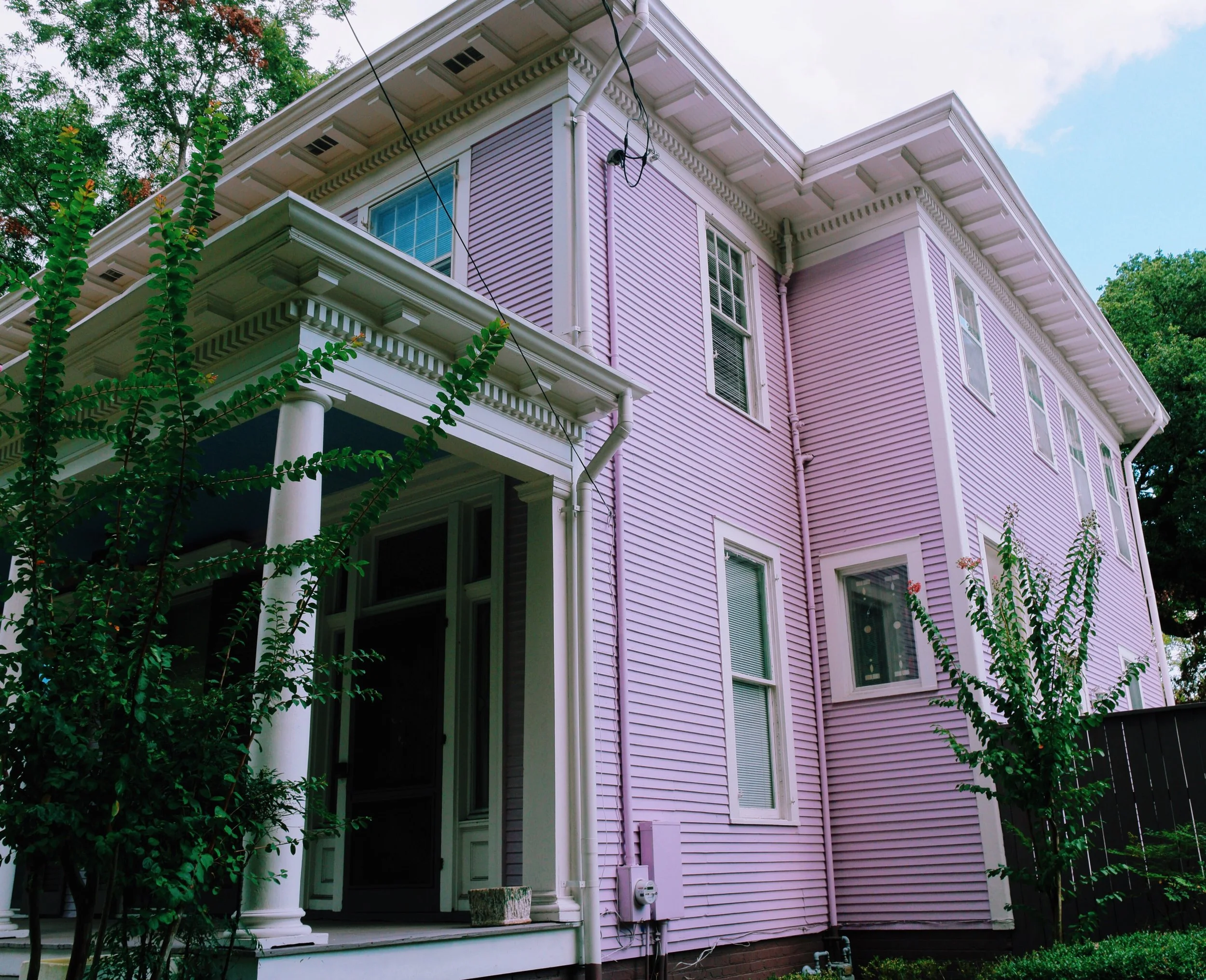 A side view of the pink house. 