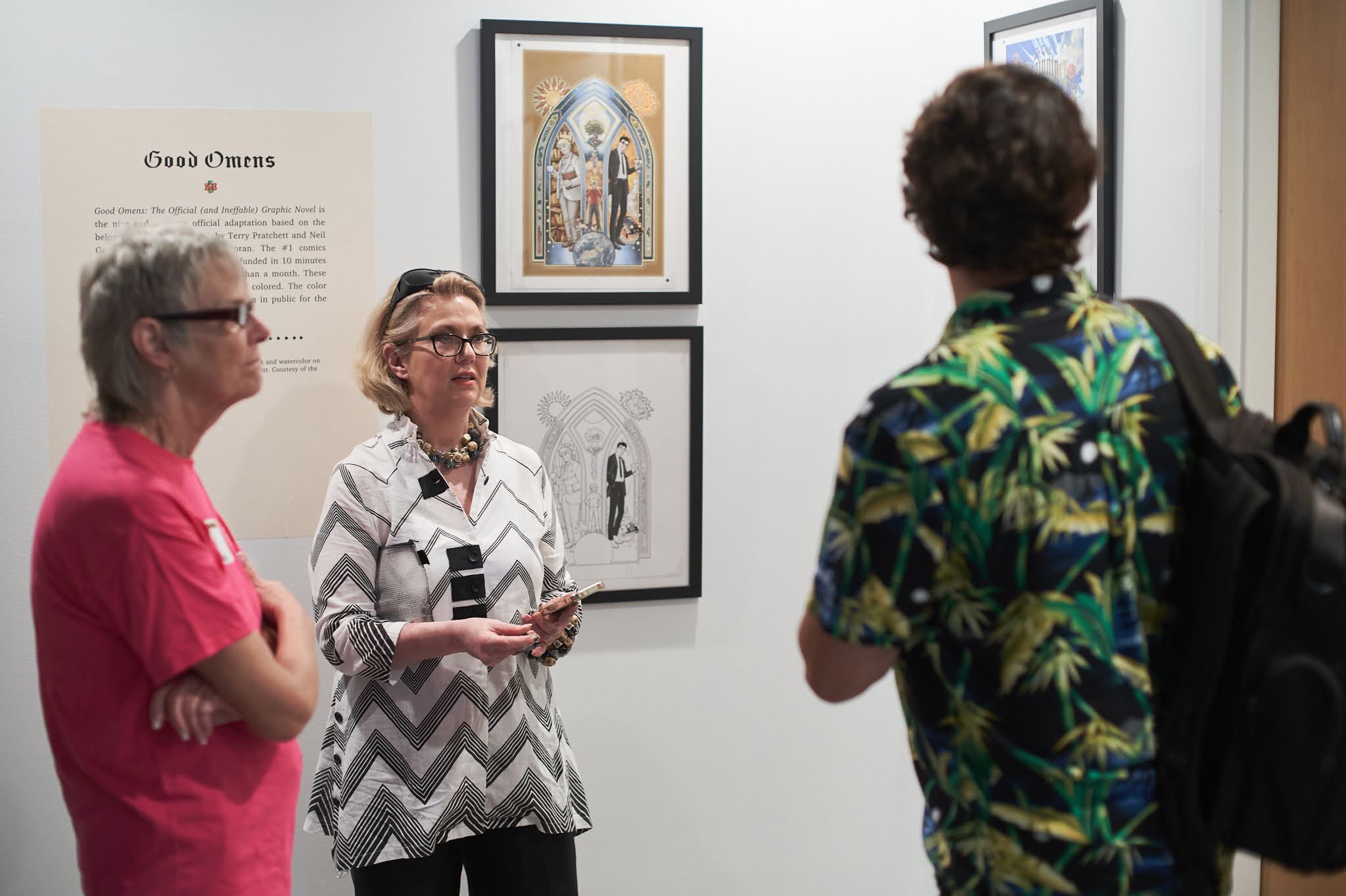  Colleen talks with visitors about  Good Omens . at the SDCC Museum member preview event on 11/3/23. Photo: N. Ricoy © 2023 SDCC. 