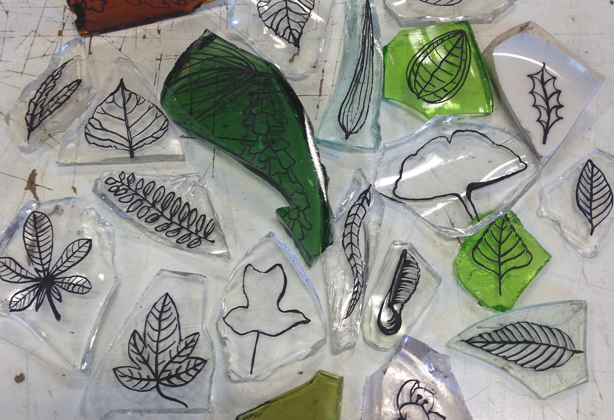Some of the hundreds of pounds of glass collected in Fort Greene Park, with etchings by Amanda Patenaude. Photo credit: urbanglass. org