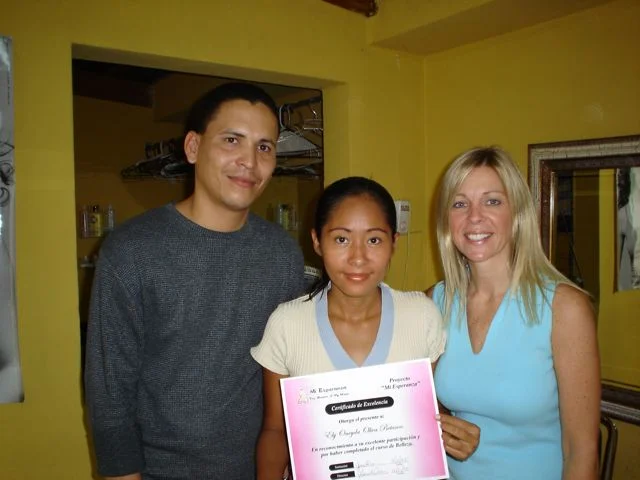  Onyeda on graduation day. &nbsp;Pictured with Leo and Gena. 