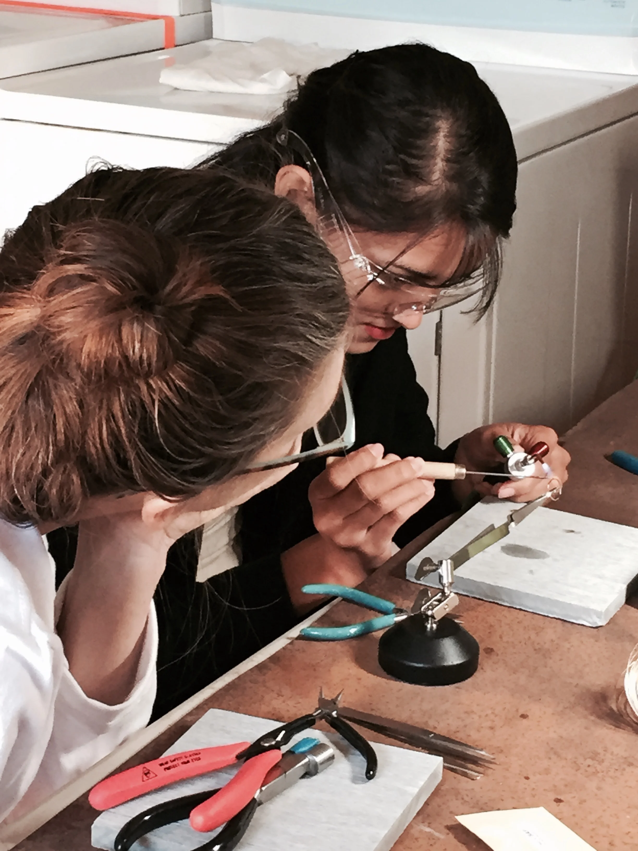 Julie working with Dilcia, one of our jewelry artisans. 