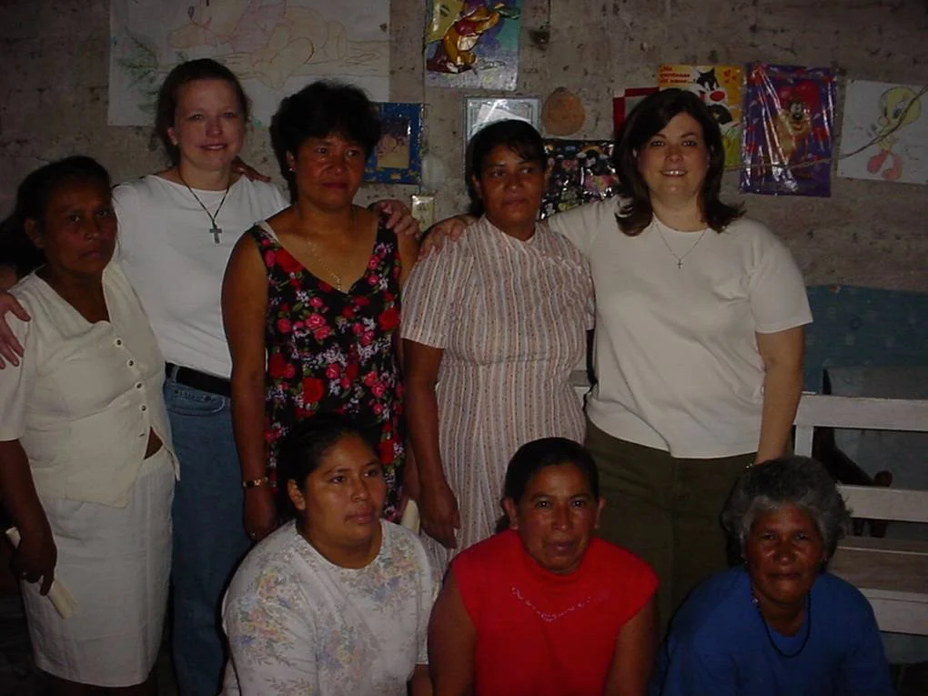Founders Janet and Lori with the first six Mi Esperanza loan recipients (2002)