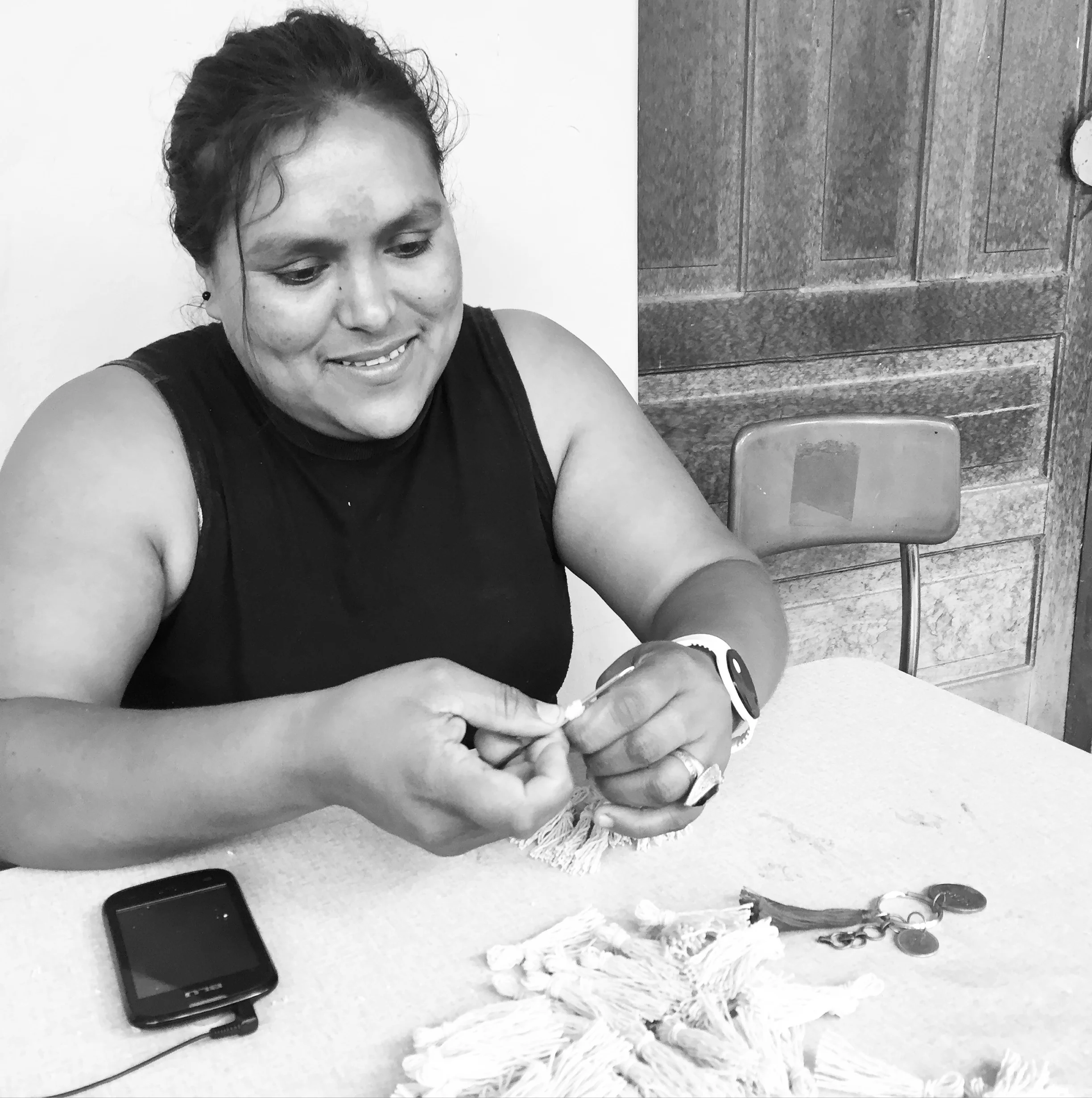 Dilcia working on handmade tassels