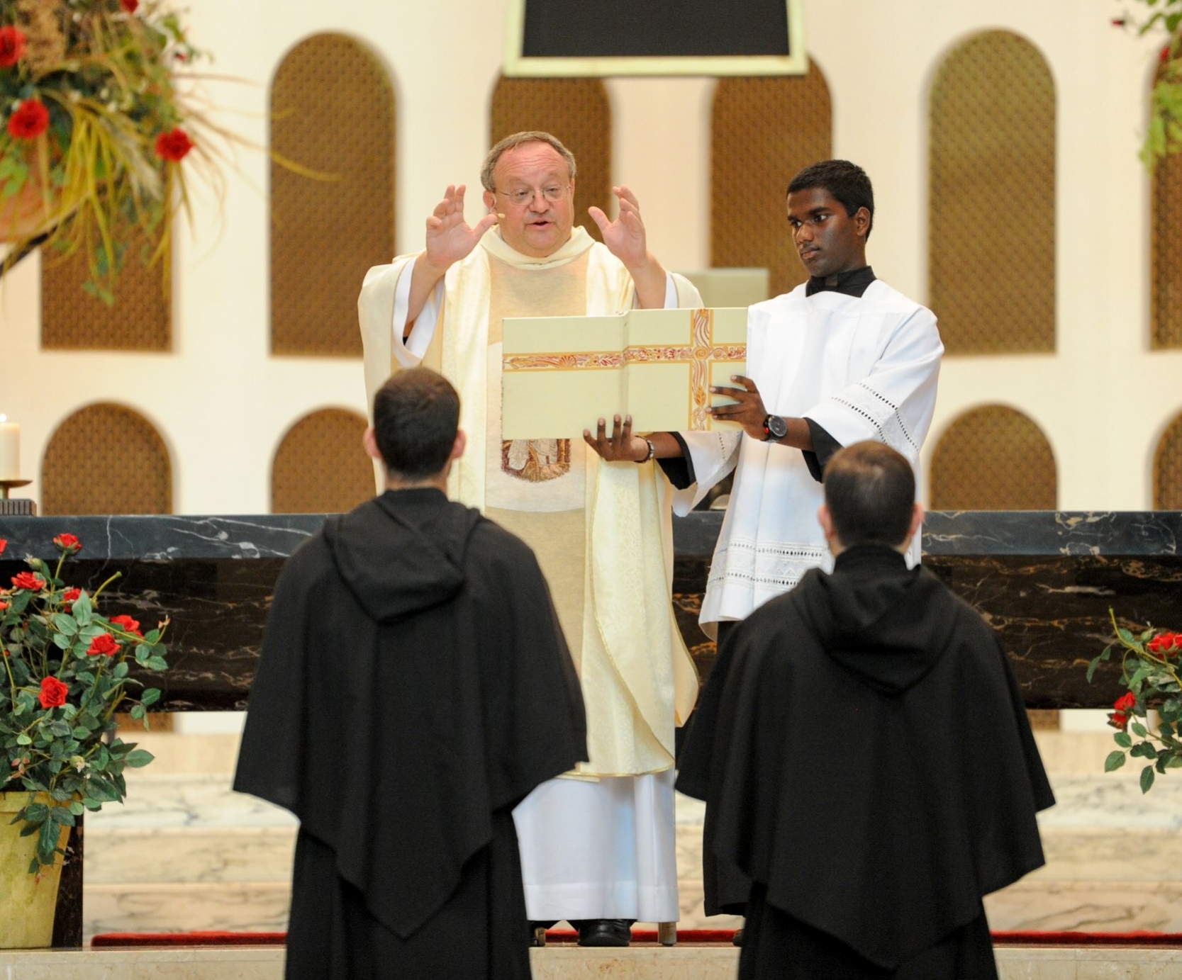 Even though one of these friars is called to ordained ministry and the other to lay religious life, both are seen here solemnly professing their perpetual vows together in the Augustinian Order