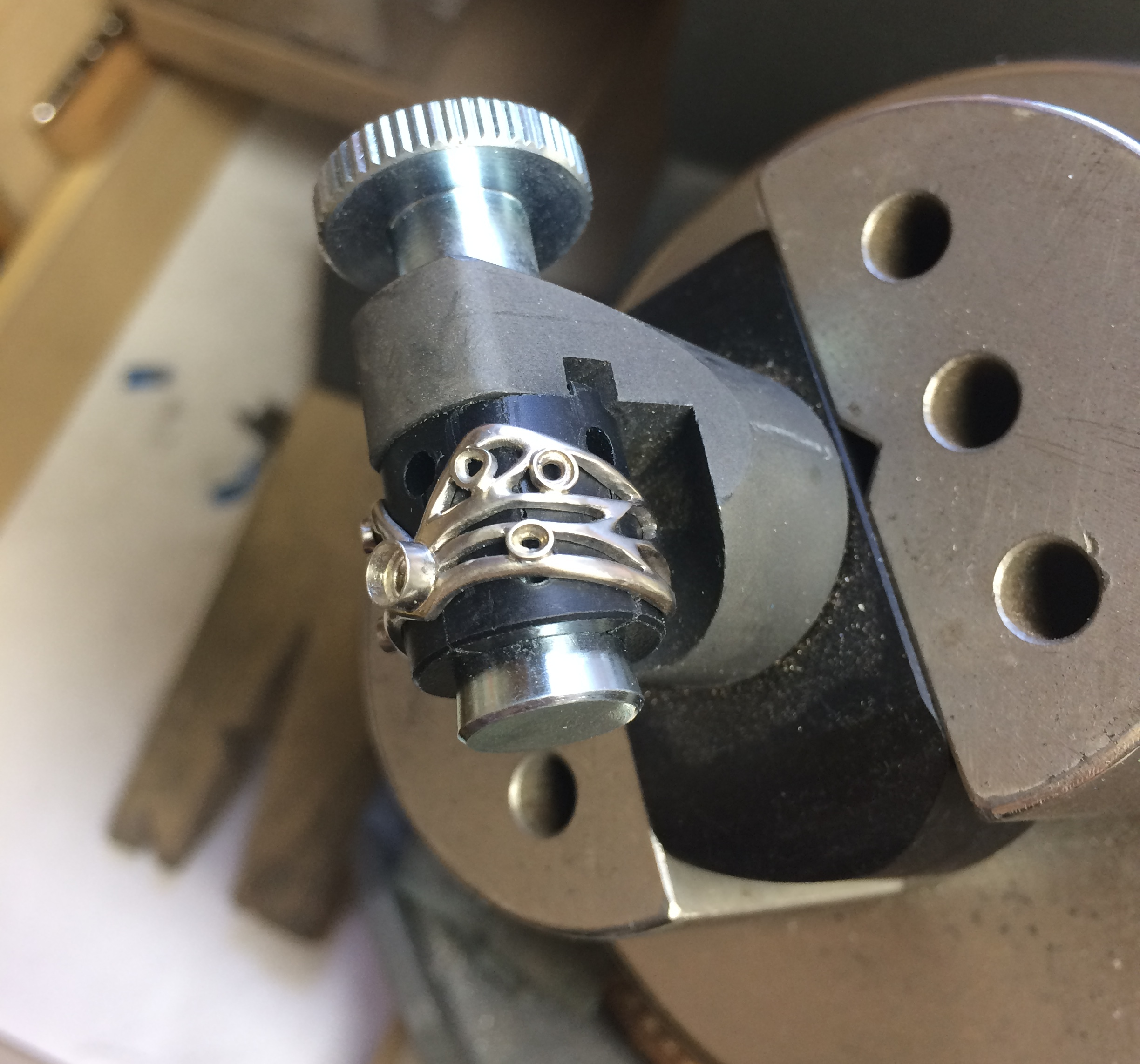 preparing to set stones in the nifty ring vice