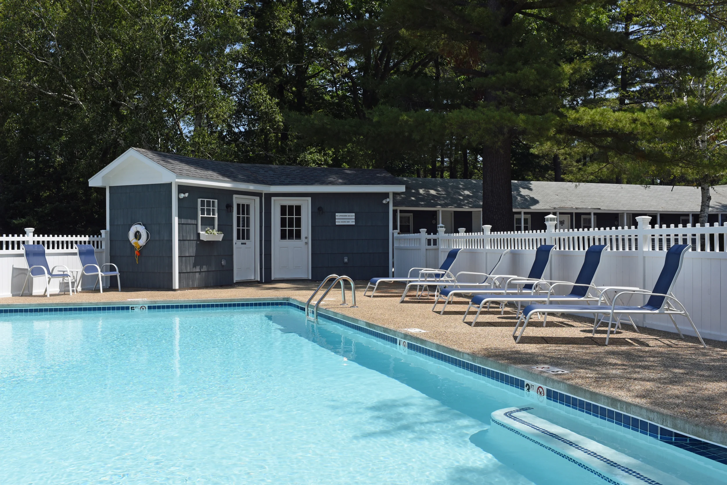 When we bought the motel last year we thought we would just fill in the existing pool as it was not in good shape and we didn't think guests would miss it. It was also not up to code, and was 8 feet deep for diving, which is of course no longer allowed. But when we opened we got loads of guests commenting on wanting a pool, and so after lots of thinking and budgeting, we went for it. First we had to cut down one huge pine tree that was shedding needles and blocking the sun - we didn't want to, but there was no way around it. We then chose Northern Pool and Spa up the road in Eliot, Maine. They shot a new gunnite pool, moved all the utilities above-ground, and then we had the deck done with exposed aggregate. It was a very mild winter so we got alot of it done before christmas. In the spring Dan finished the shed and wood fence and our family painted it. Finally, we chose to put a salt generator in instead of chlorine to clean the pool. It was more money up front, but the dividends of having no chlorine and a better system seemed to make sense. We were worried the pool would be like the ocean, but it's not salty at all. Here are some pics of the process below Pool hours are 9am-9pm. Depths is 3 feet x 5 feet. It's good size - 18 x 38 feet. Pool towels are provided. Pool season is memorial day weekend to labor day weekend.
