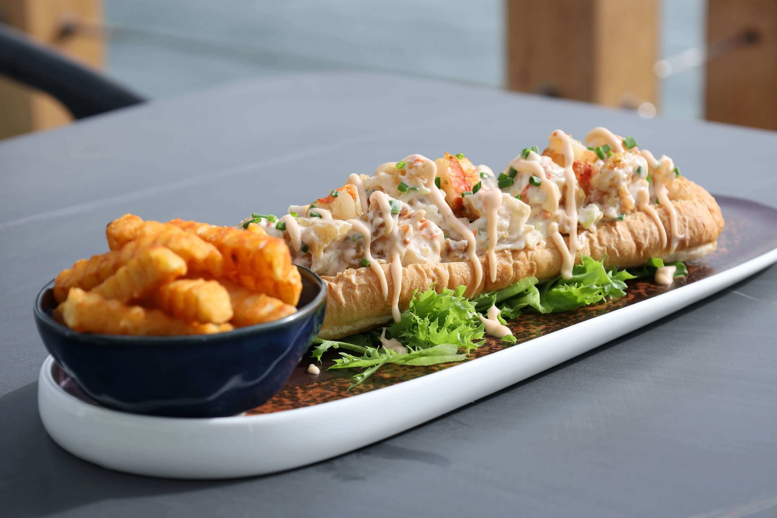Fresh lobster roll served with Fries in Kittery Maine Restaurant
