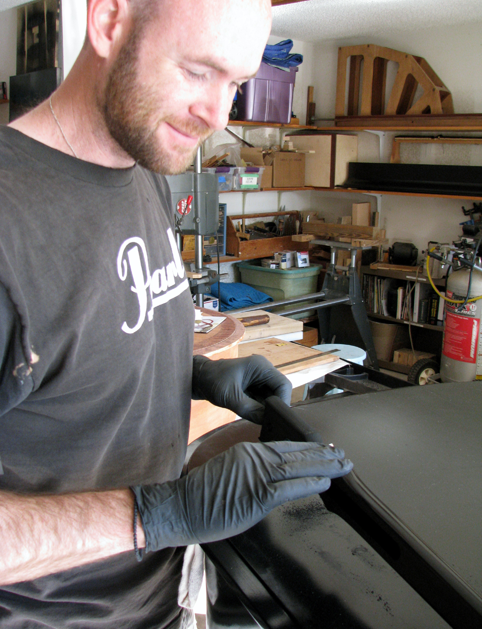 Rubbing out the lid prop. Steinway &amp; Sons Model L. Hand-rubbed black lacquer, satin finish. Watson Piano Works, 2015. 