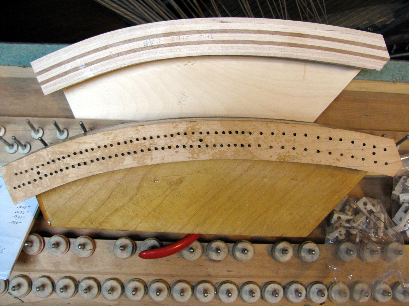  Here, Watson Piano Works has created a new, laminated bass bridge to replace an old, cracked bridge that had become unstable. 