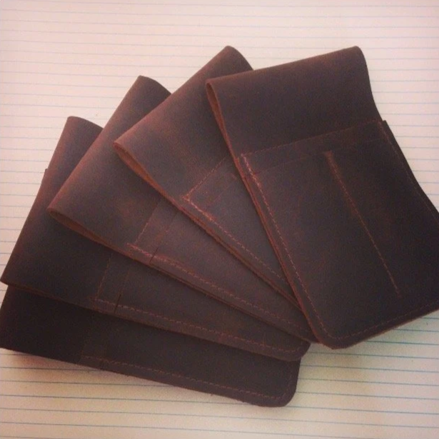 Leather waitstaff belt pouches.
