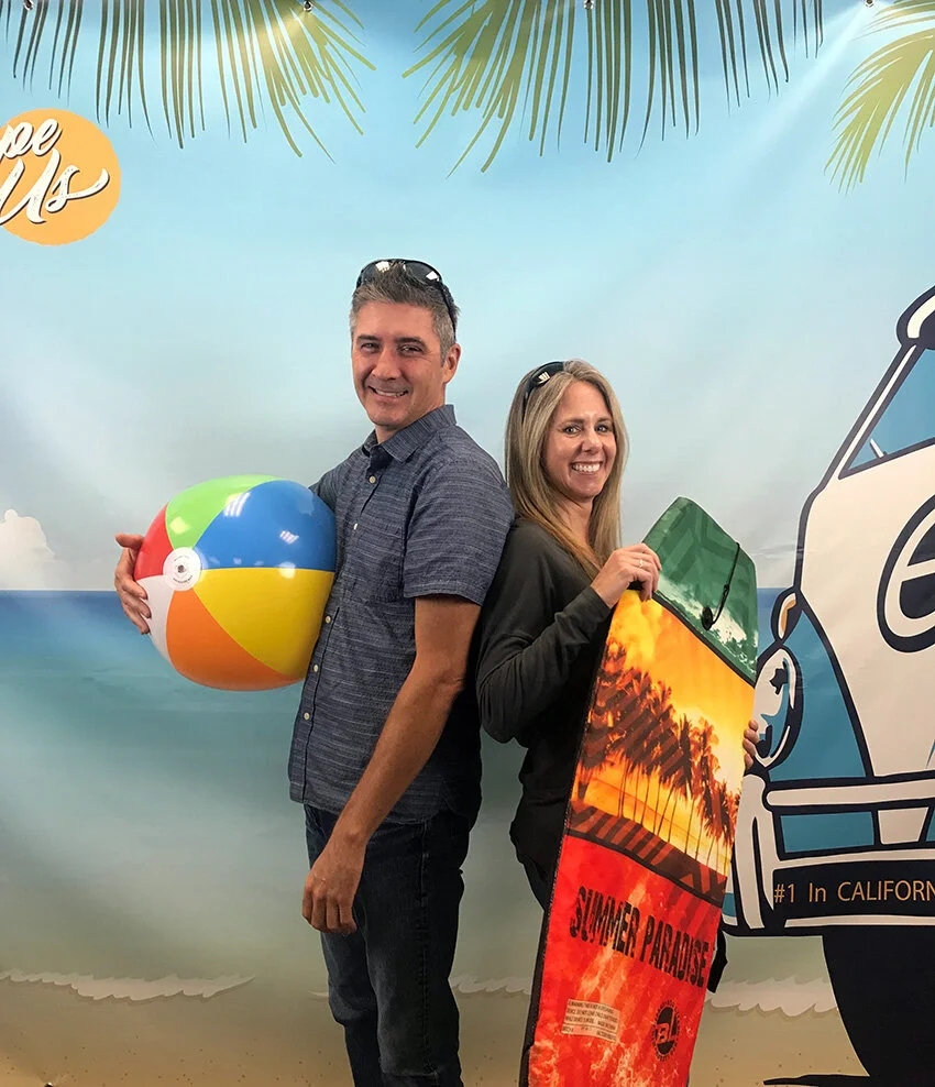 Kirk Hamman, Sr. UI/UX Designer, and Jennifer Escamilla, Escape Product Manager, get ready for the Online 6 beach party!