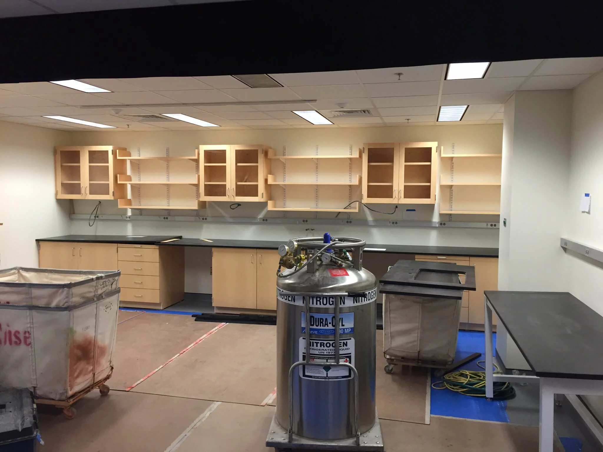 Benches and cabinetry going up in 2P room.