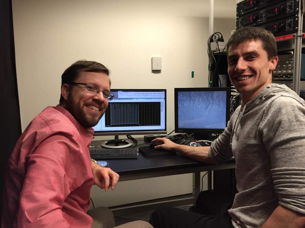 Lou patches a neuron during his rotation in the lab.