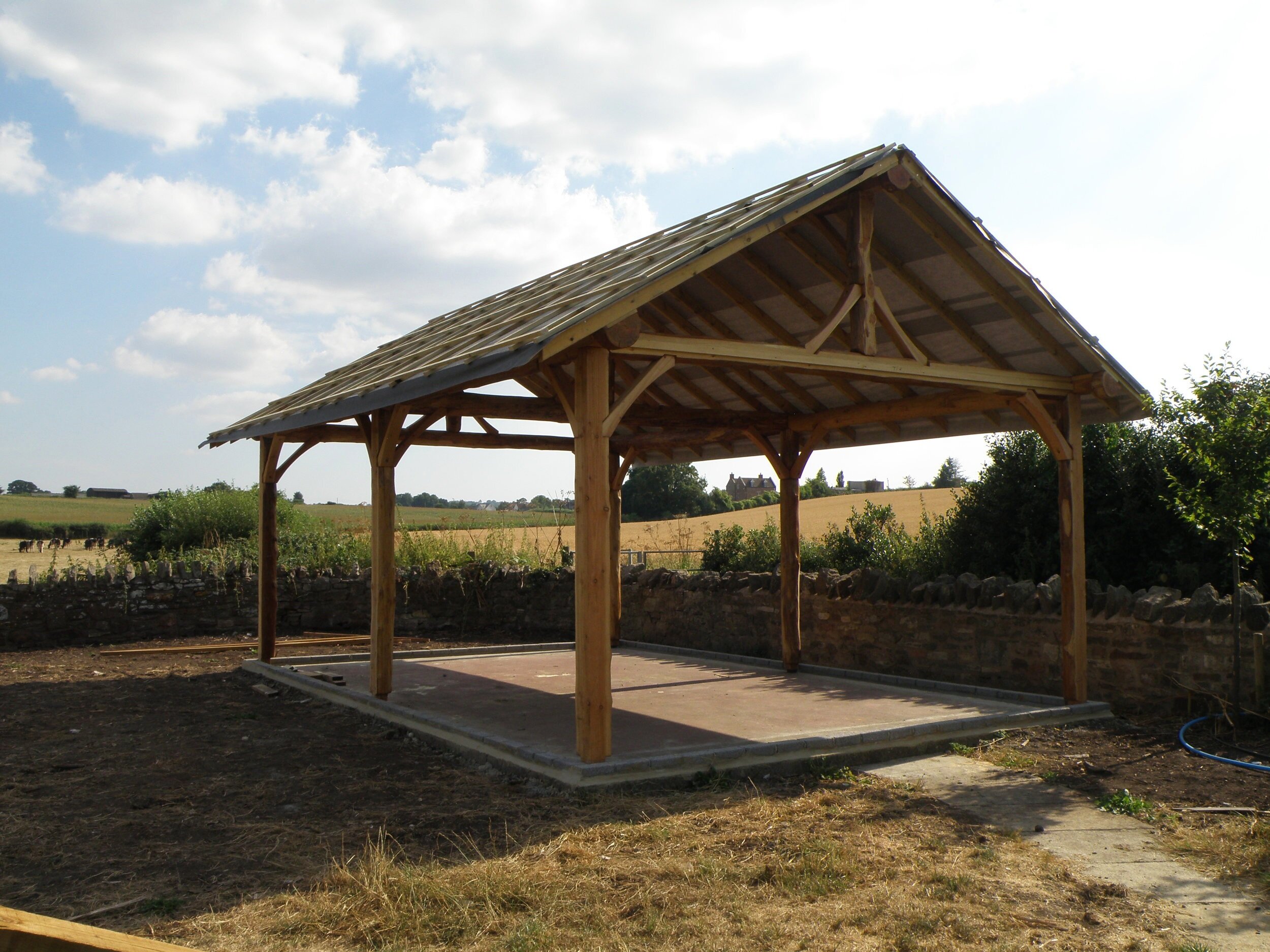 bare+round+pole+timber+frame+larch+tin+roof+self+build+green+carpentry+bristol+roundwood+design.jpg