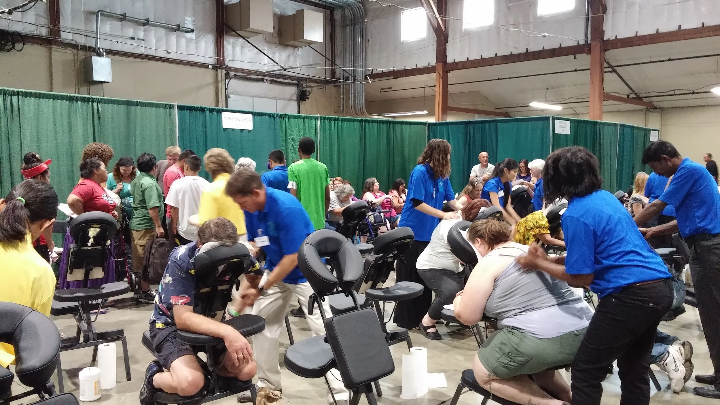 Massage therapists provide care at Pathway to Health 2015.