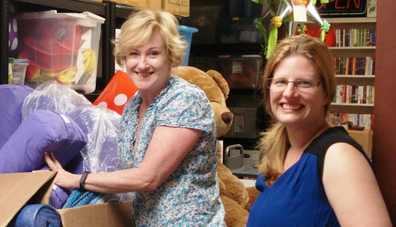 Instructor Suzy McNeilly and project coordinator Sara Garza sort through yoga equipment for new classes. Photo Credit: Whitman County Library.