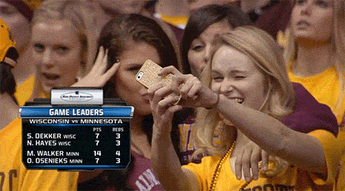 minnesota-gopher-chicks-take-selfies-during-the-wisconsin-game.gif