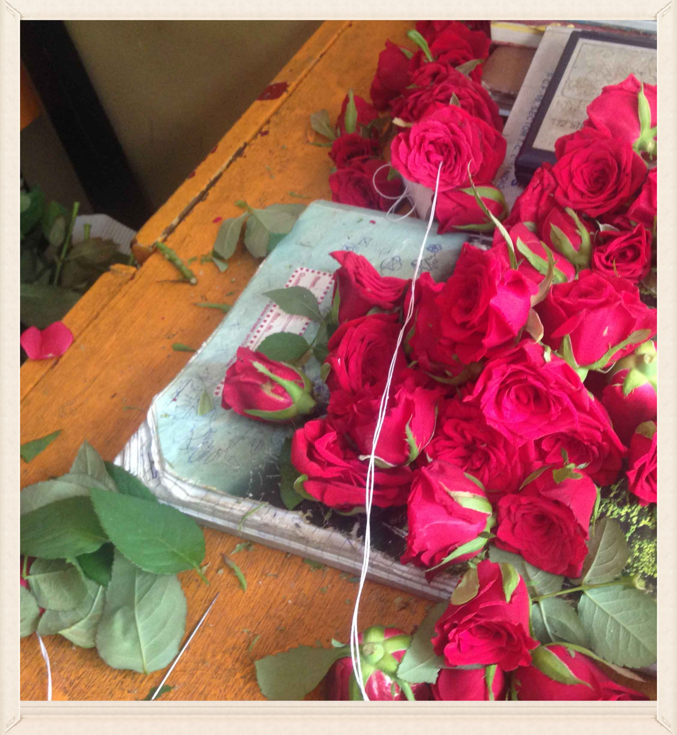Threading a rose garland, image©gunjanvirk.