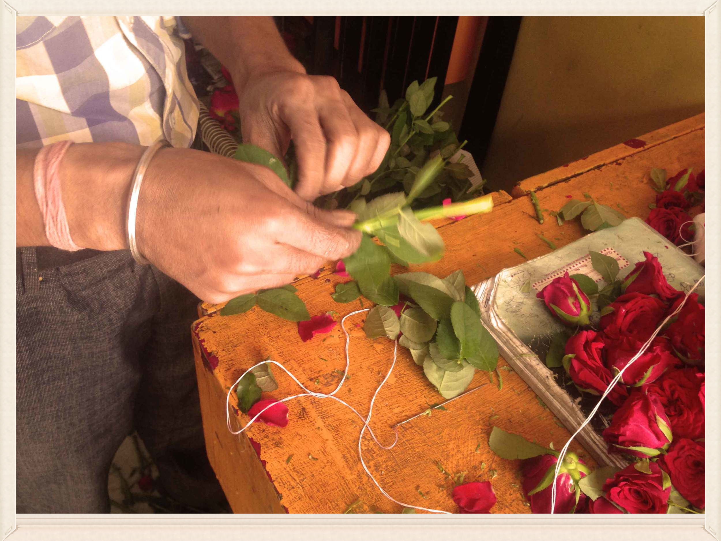 Making a rose garland, image©gunjanvirk.
