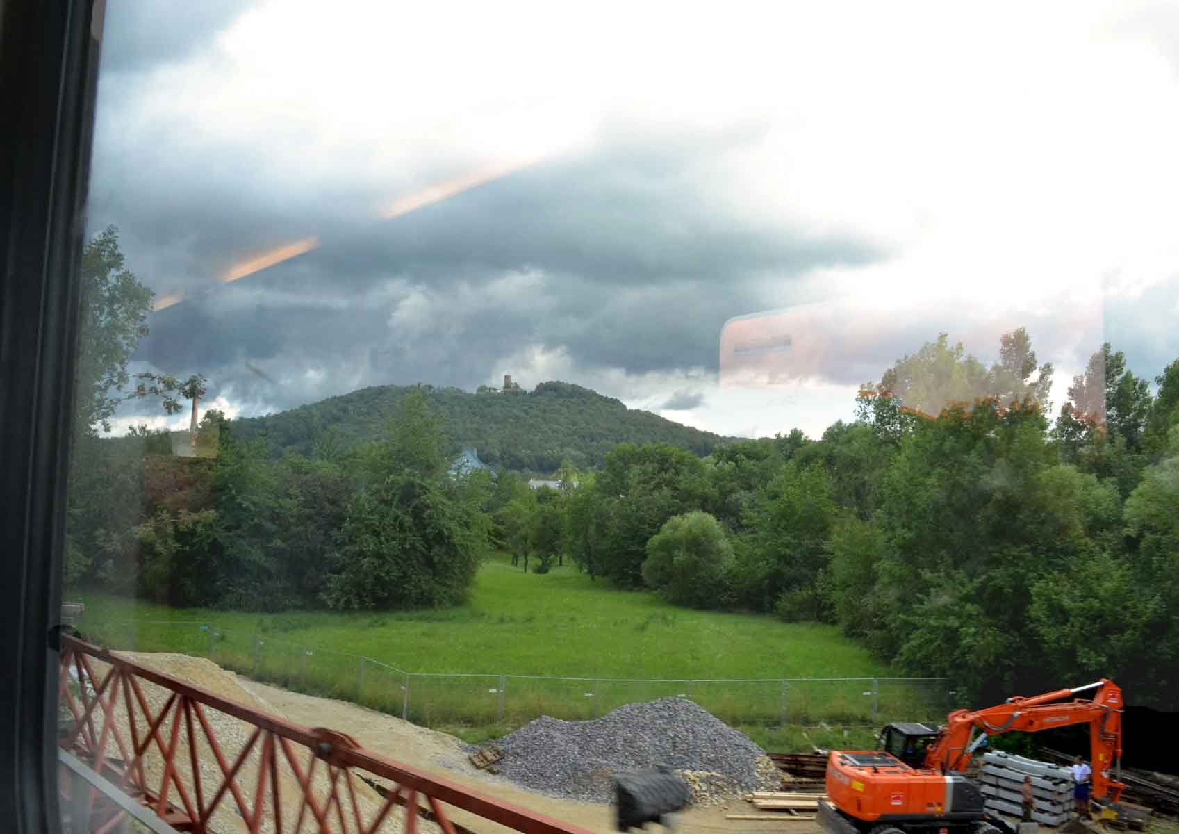 Watching construction work from train window while traveling in Germany. Image©gunjanvirk