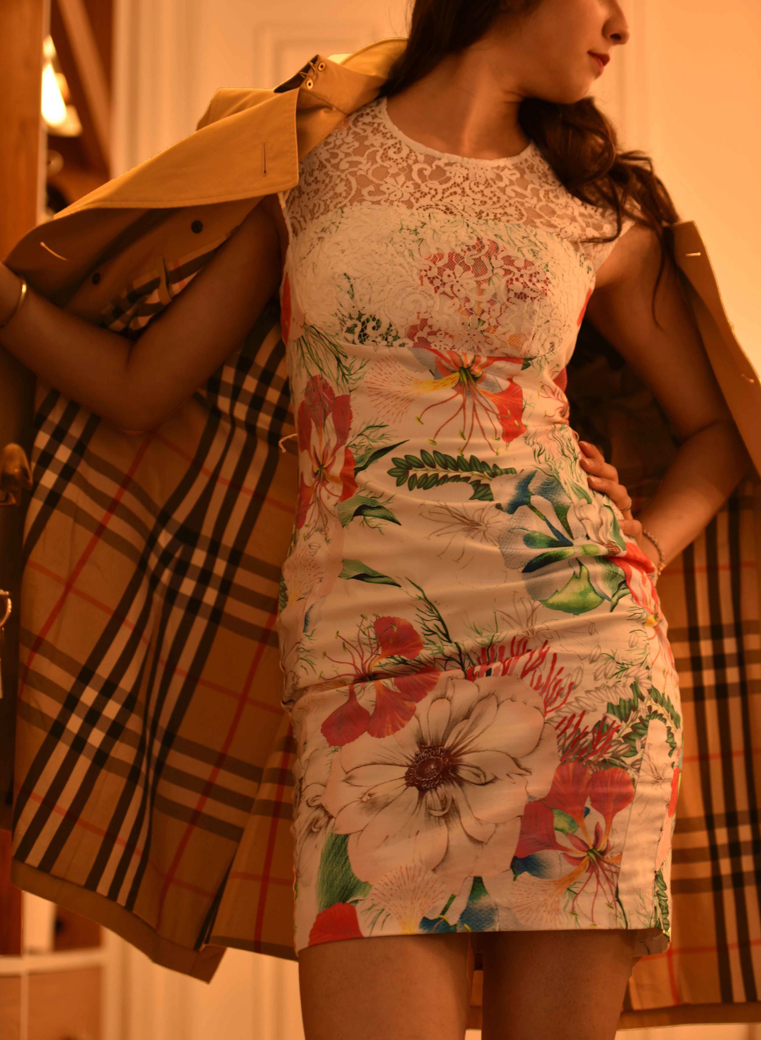 A floral printed sheath dress, a classic Burberry trench coat. Image©sourcingstyle.com