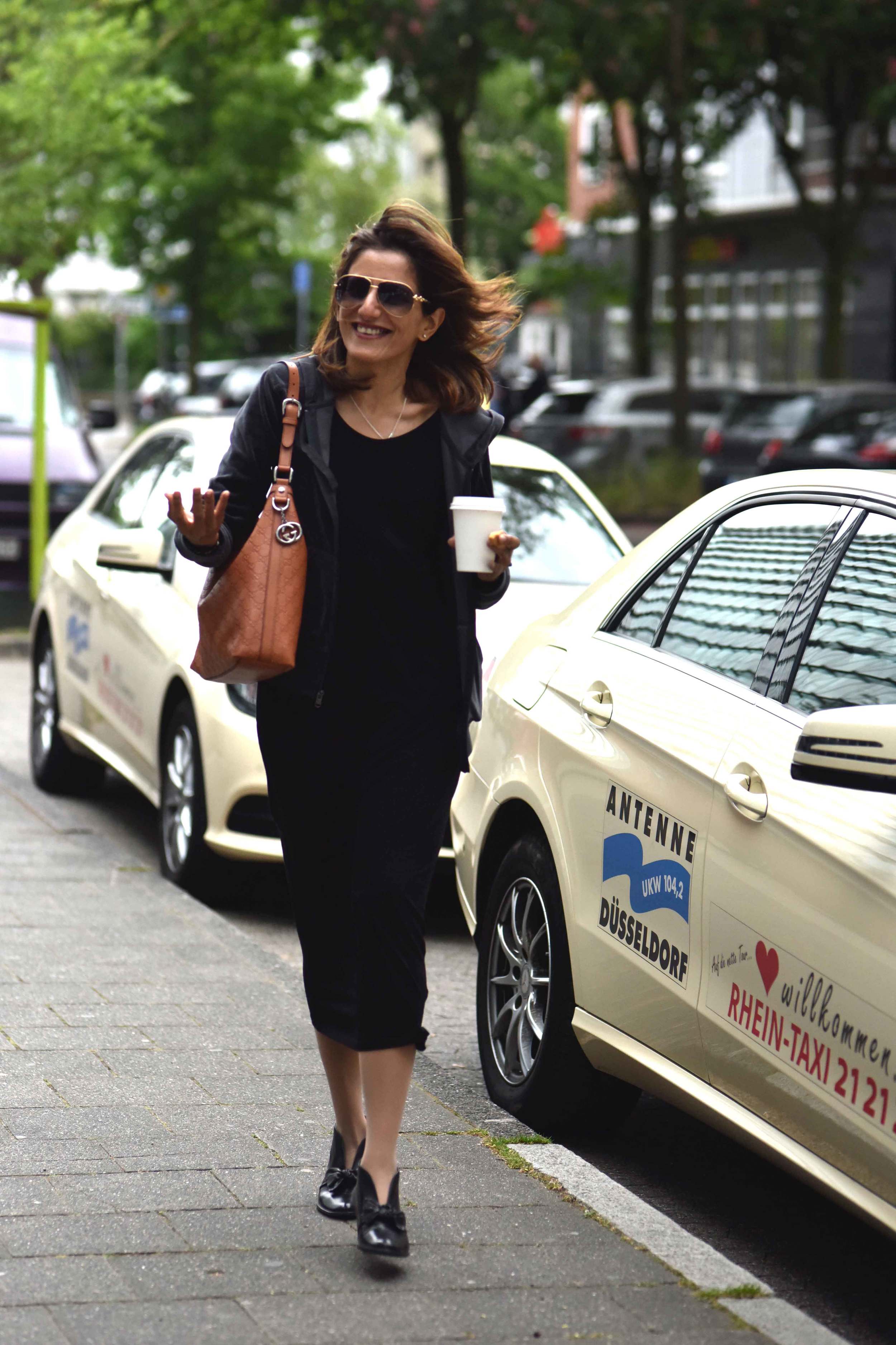 Wearing Eileen Fisher black tank dress in viscose jersey, little black dress, Gucci handbag, Eddie Bauer velour jacket, Düsseldorf city, Germany. Image©sourcingstyle.com, Photo: Nicola Nolting.