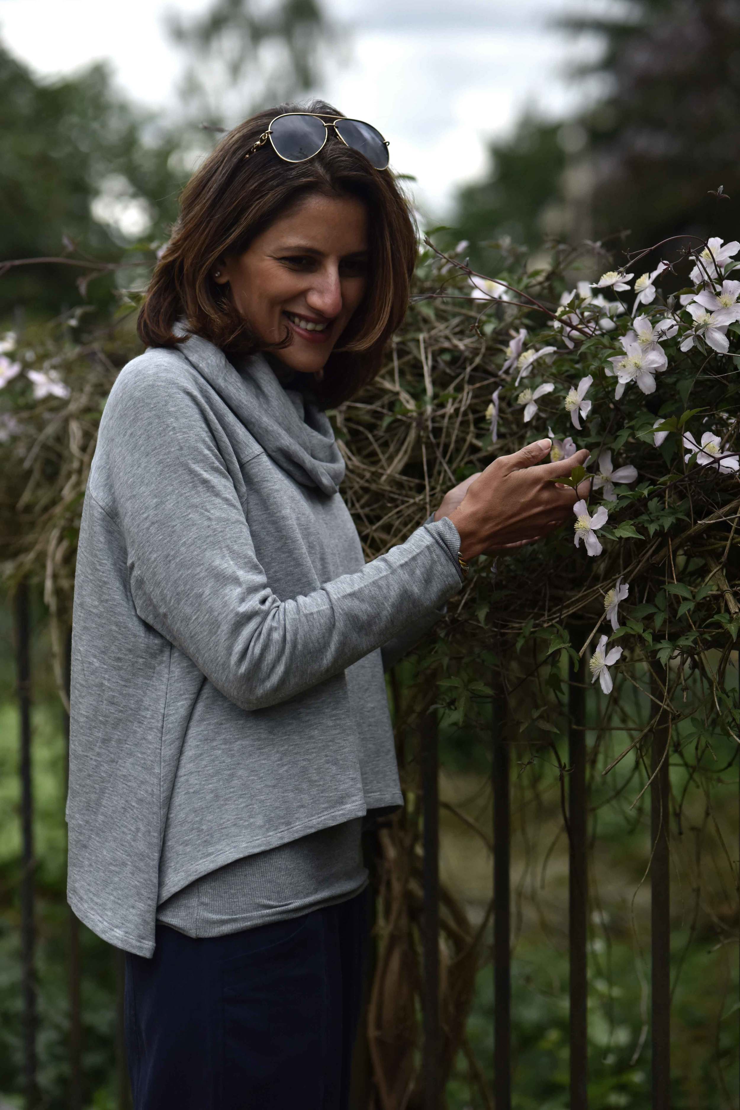 Happy with flowers. Eileen Fisher Funnel Neck Drapey Tencel Terry Cropped Top in Moon. Image©sourcingstyle.com, Photo: Nicola Nolting