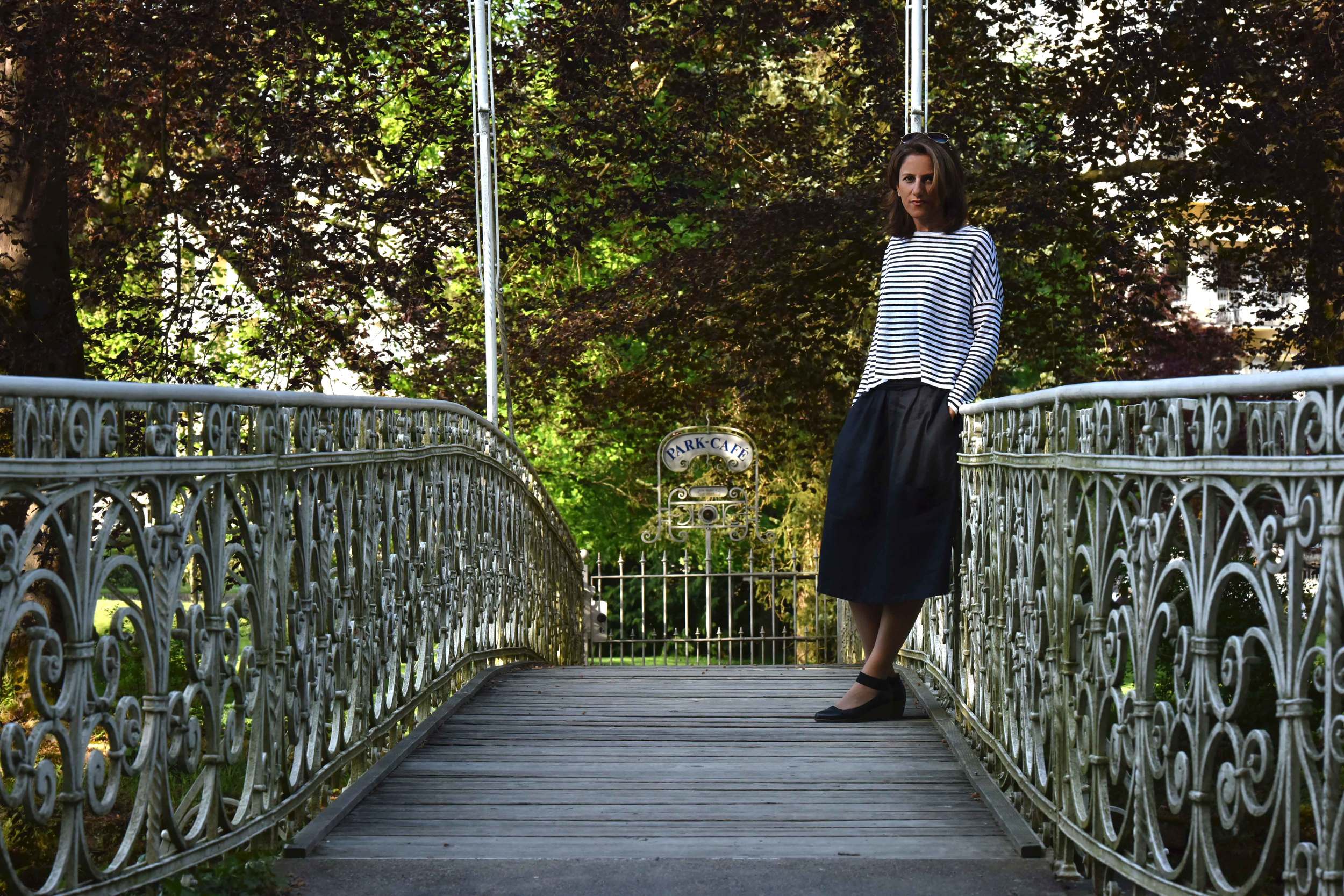 Eileen Fisher boxed top, Eileen Fisher oval skirt, bridge on Oos river, Bellevue Brücke, Baden Baden, Germany. Image©sourcingstyle.com