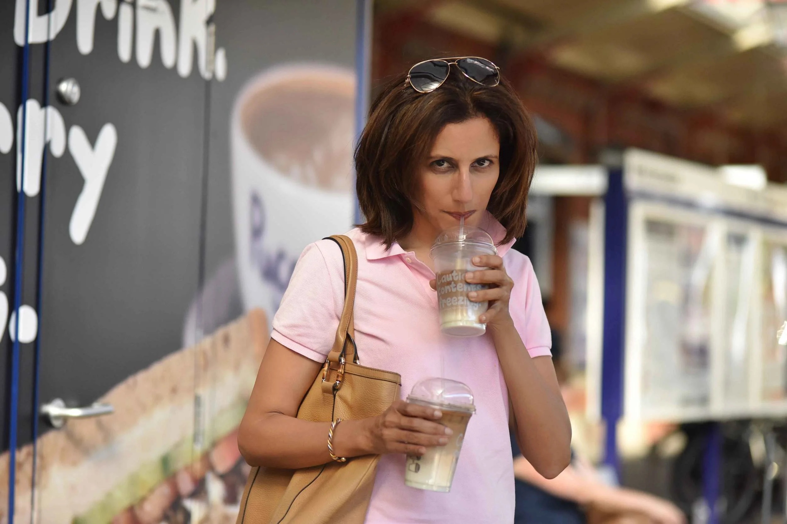 Sipping iced latte, London underground, Image©sourcingstyle.com