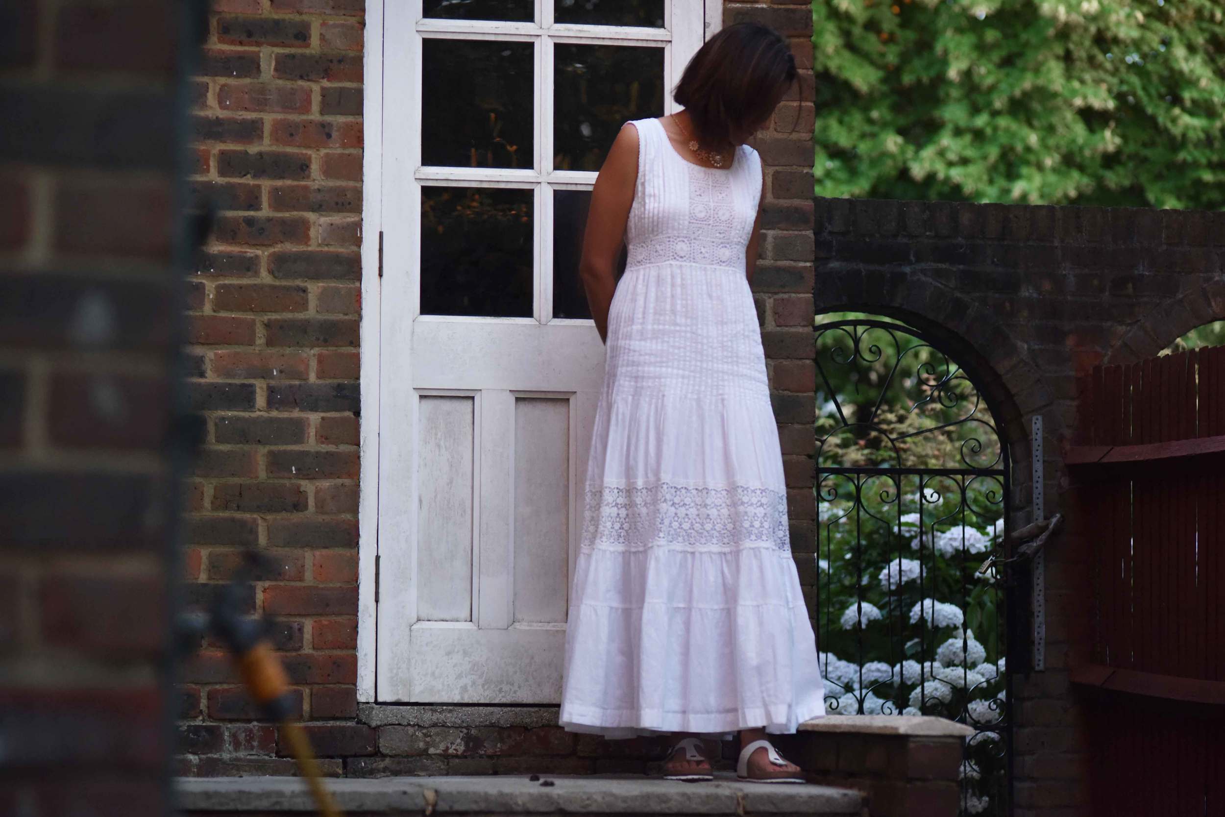 White Chicos lace and crochet maxi dress, necklace from Primark, Birkenstock slippers, image©sourcingstyle.com