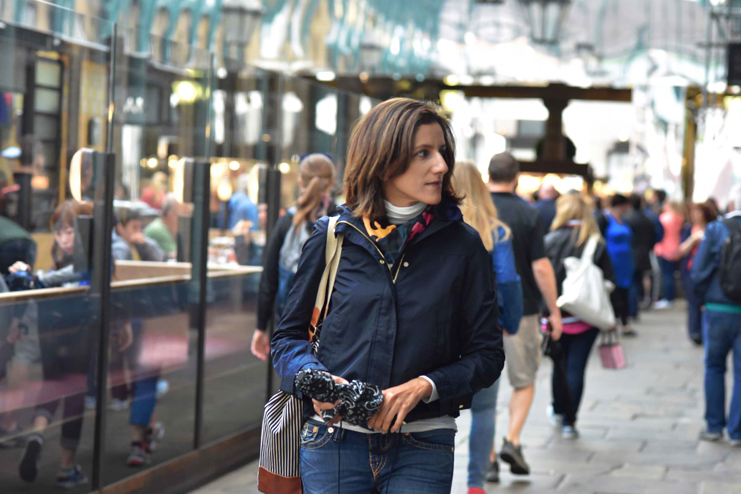 Zara water repellent jacket, Zara printed pocket square, Zara bandana print umbrella, True Religion jeans, Ralph Lauren polo sweater, Apple Market, Covent Garden, London, UK. Image©sourcingstyle.com