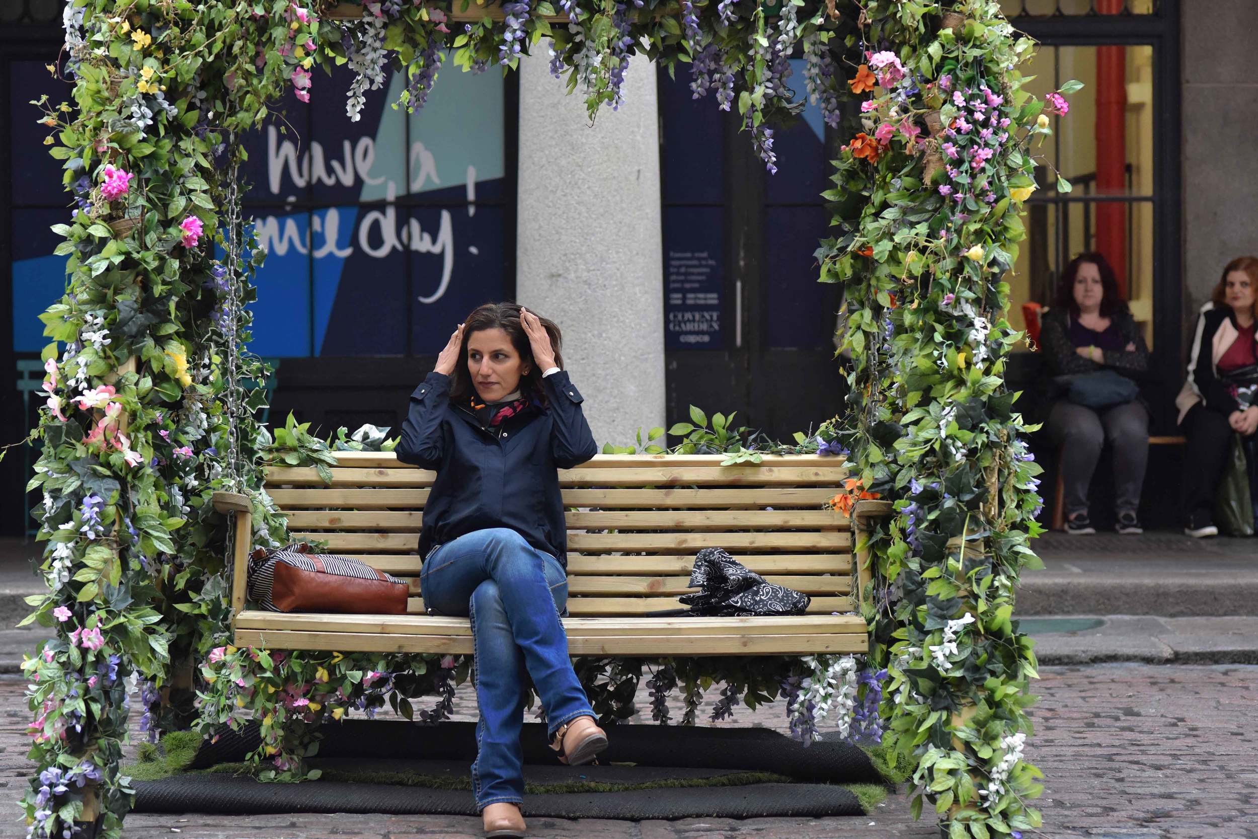 Zara water repellent jacket, Zara printed pocket square, Zara bandana print umbrella, True Religion jeans, Uggs boots, Covent Garden, London, UK. Image©sourcingstyle.com