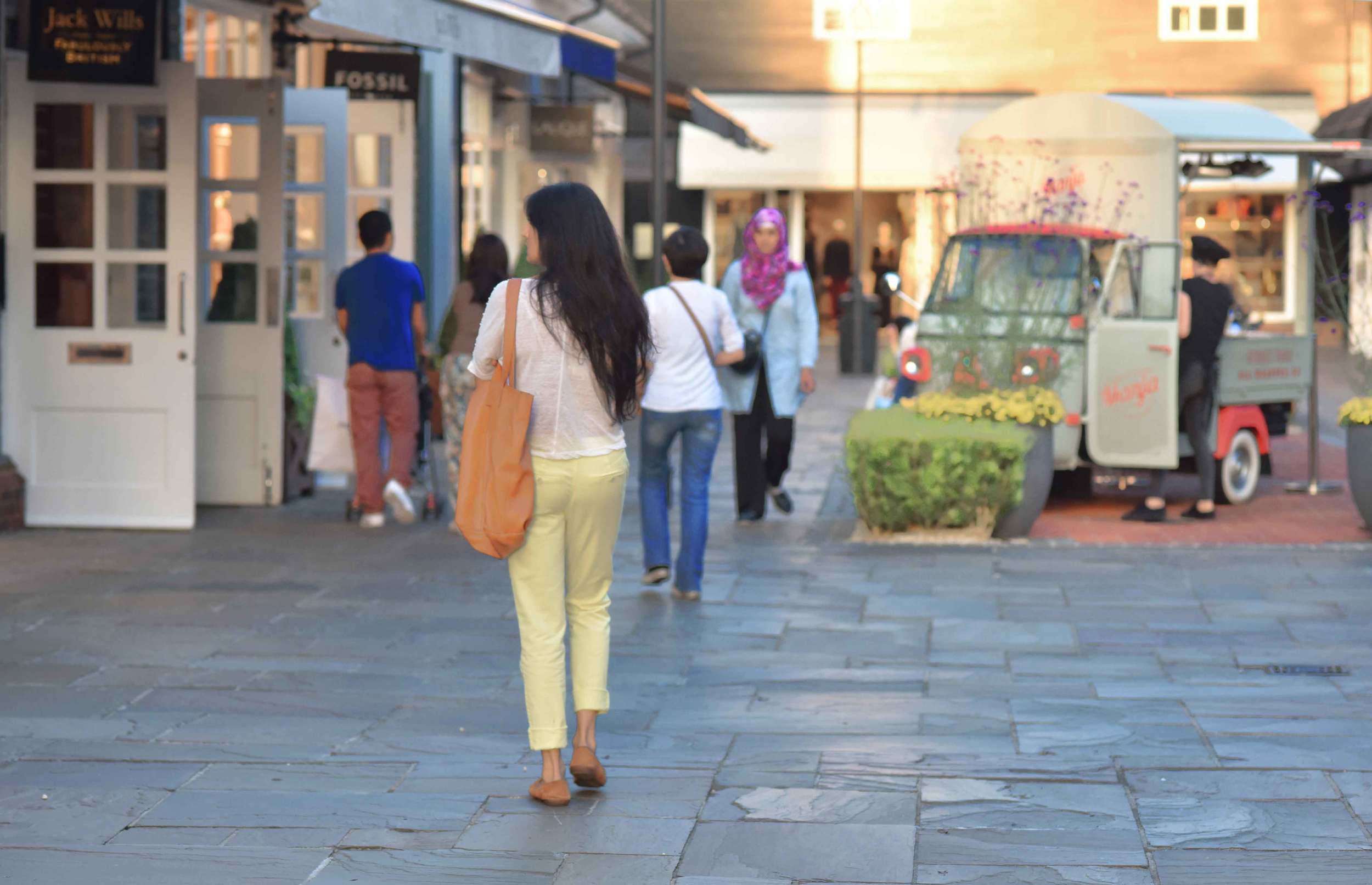 My cousin walks dreamily by! Bicester village, designer shopping outlet near London, UK. Image©sourcingstyle.com