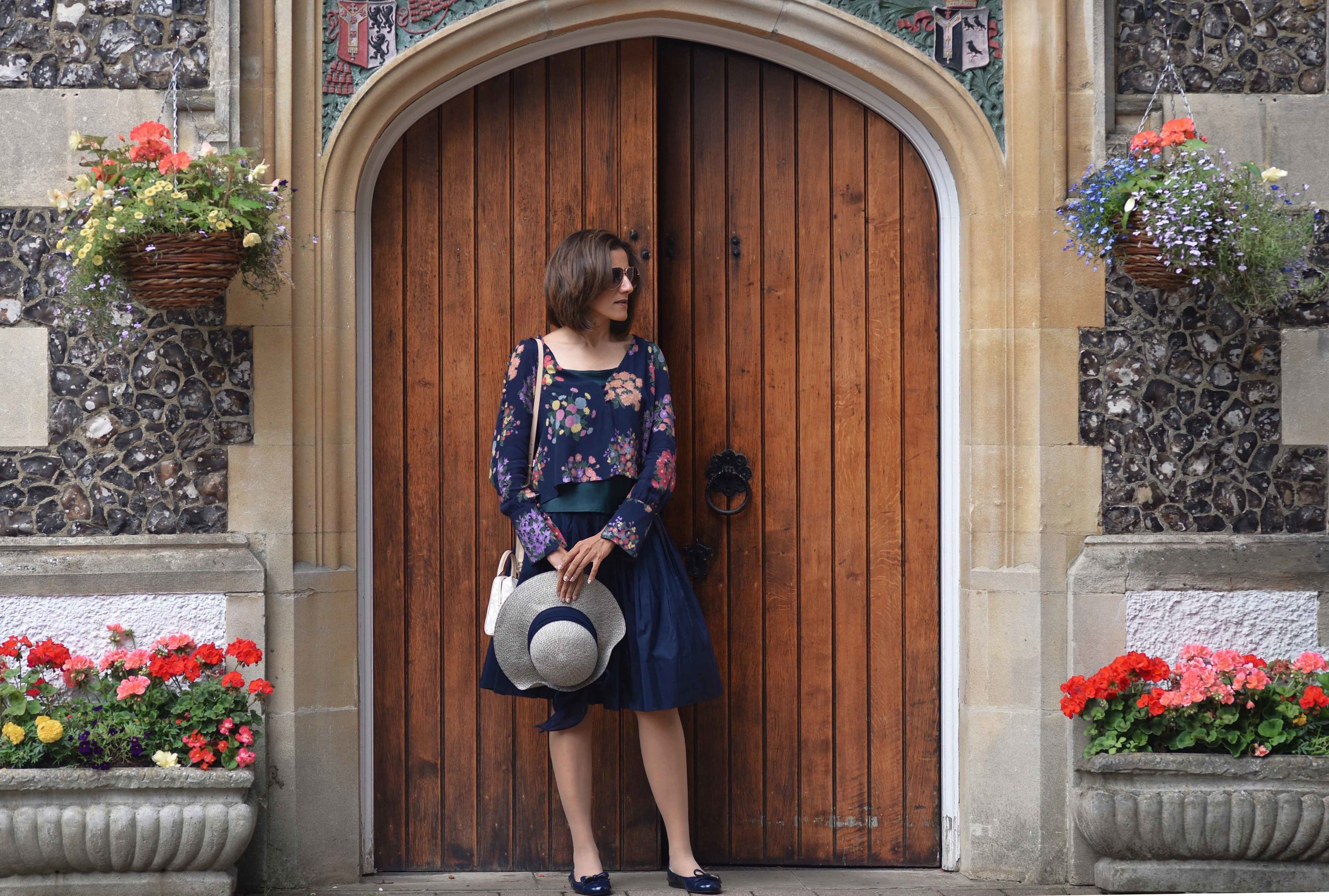 Zara floral top, Talbots silk Taffeta skirt, Talbots silk camisole, Prada ballet flats, M&S hat, Michael Kors bag. Image©sourcingstyle.com