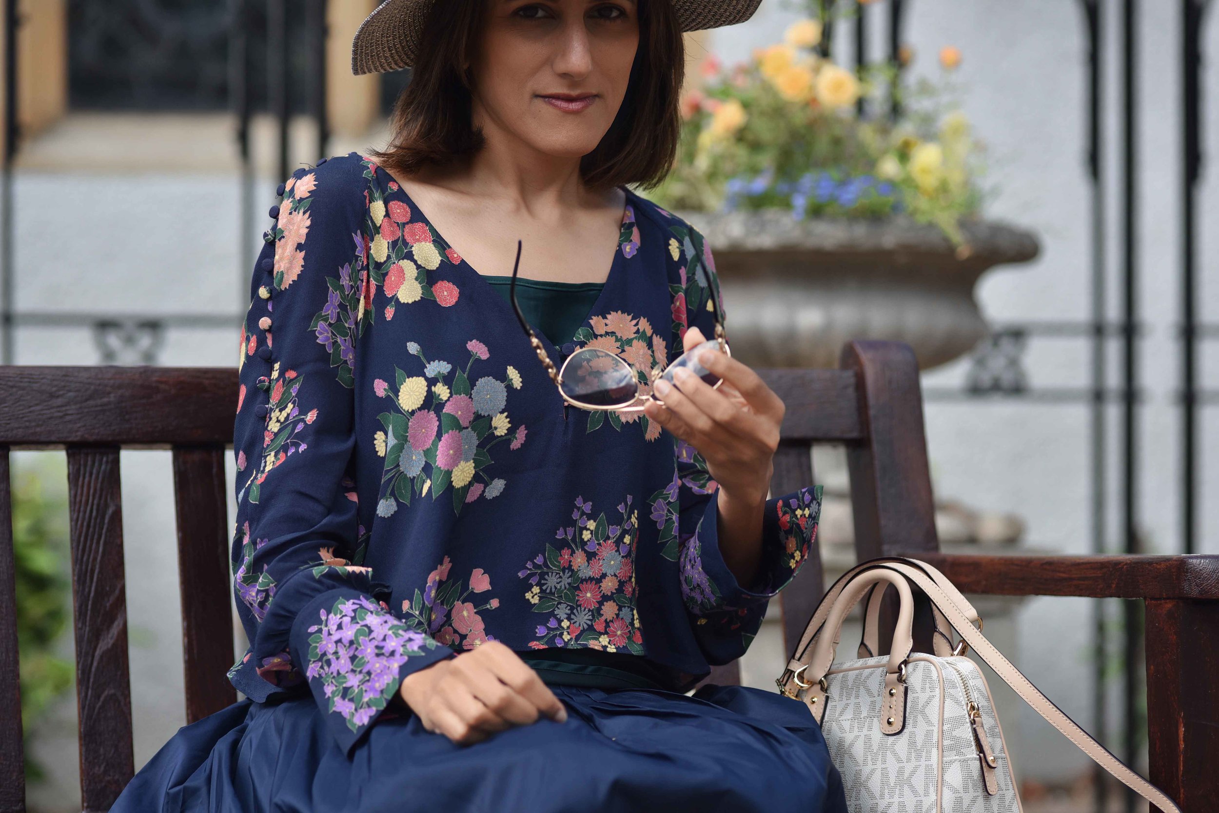Zara floral top, Talbots silk Taffeta skirt, Talbots silk camisole, Michael Kors bag, M&S hat. Image©sourcingstyle.com