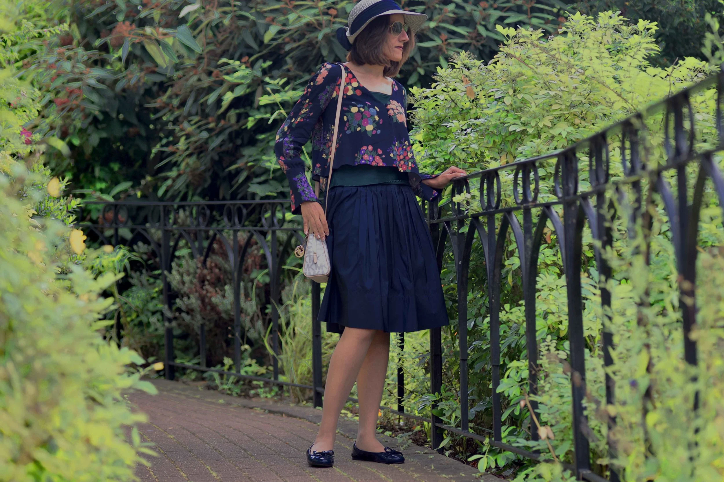 Zara floral top, Talbots silk Taffeta skirt, Talbots silk camisole, Michael Kors bag, Prada ballet flats, M&S hat. Image©sourcingstyle.com