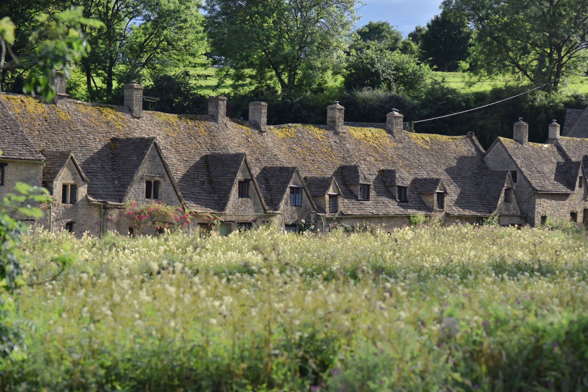 Cotswold stone cottages, Arlington Row, Bibury, Cotswold, England. Image©sourcingstyle.com