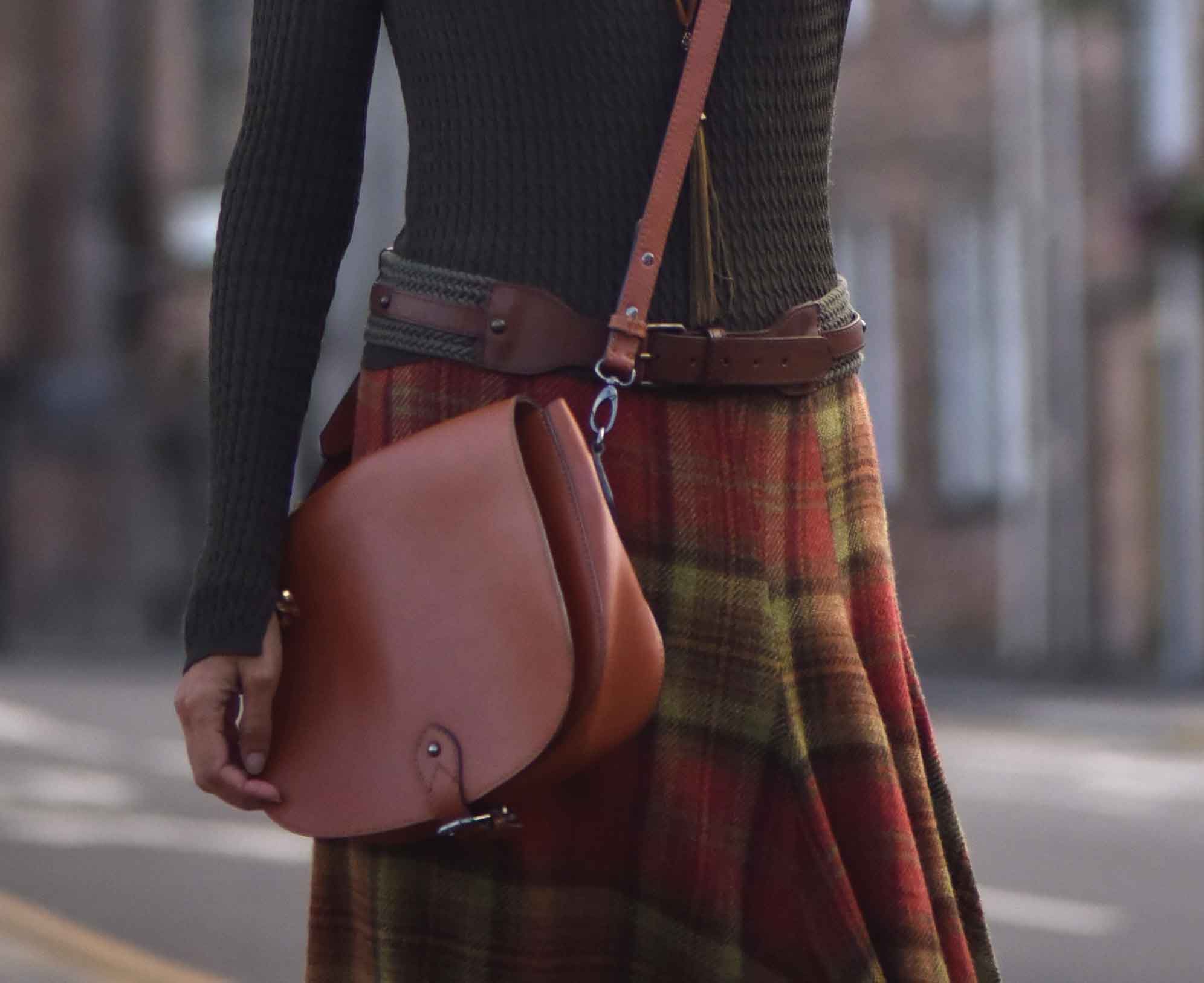 Ralph Lauren Blue Label plaid uneven hem skirt, tan Clarks bag, Inverness. Image©sourcingstyle.com