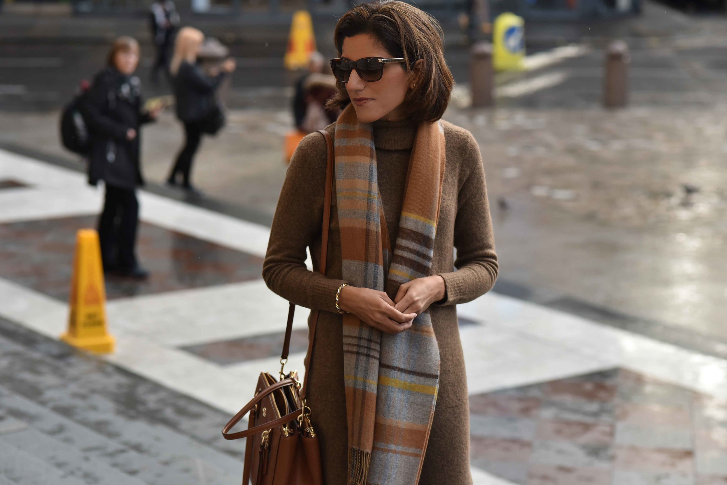 Marks & Spencer sweater dress, Marks & Spencer plaid scarf, Coach handbag, Gucci sunglasses. Photo: Alizeh Latif. Image©sourcingstyle.com.