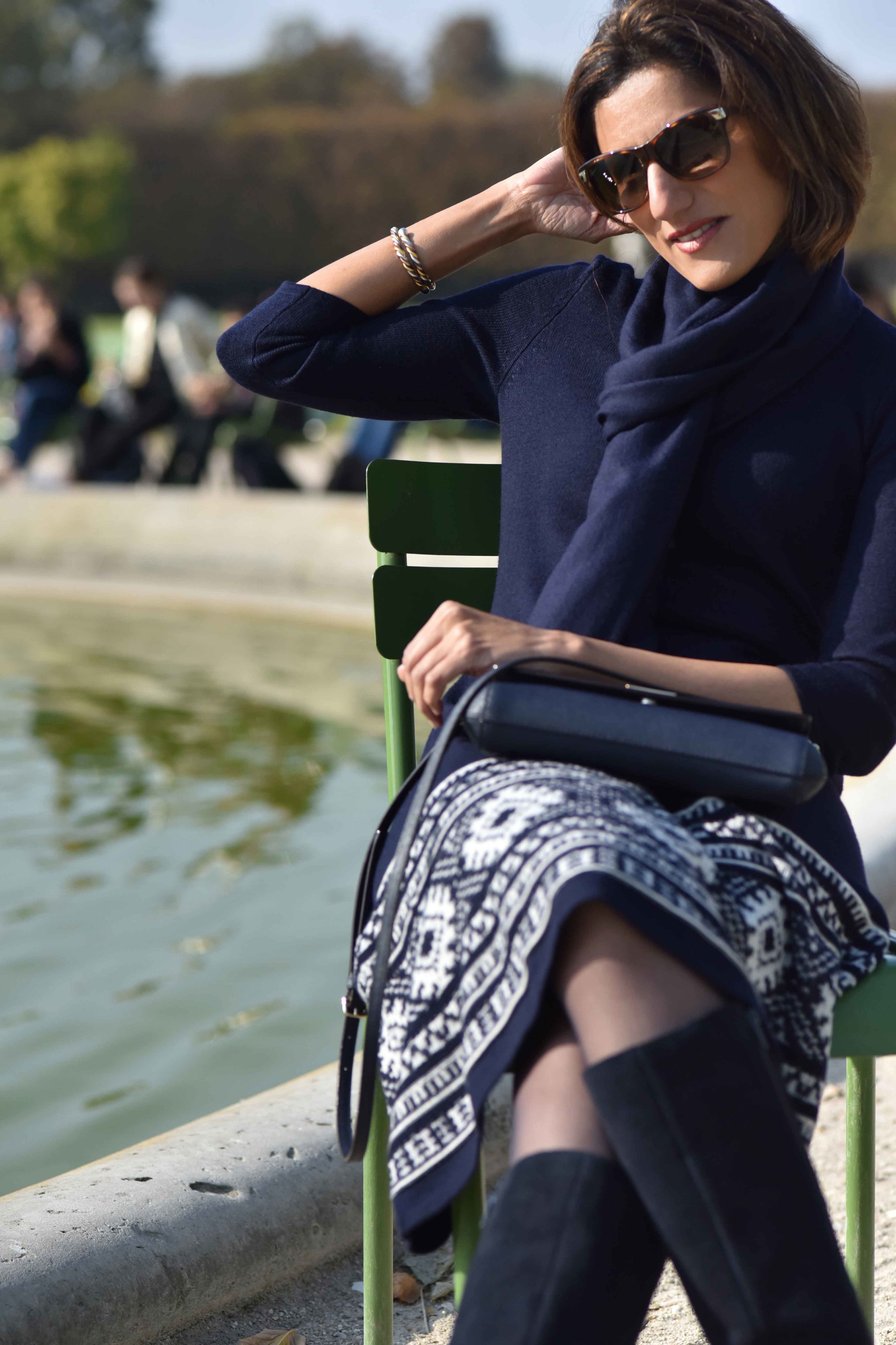 Ralph Lauren woolen jersey knit dress, Marks & Spencer knee high boots, Kate Spade sling bag, Jardin de Tuileries, Paris. Photo: Nina Shaw. Image©sourcingstyle.com
