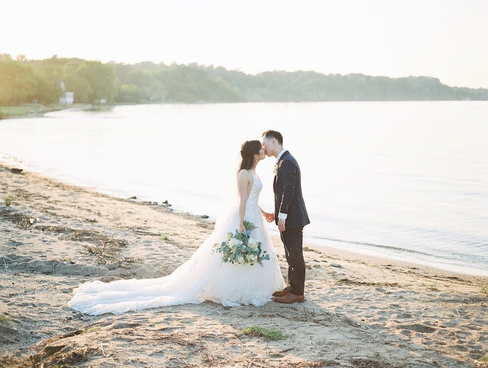 herrington-on-the-bay-wedding-venue-in-maryland-asian-american-ceremony-christian-blue-bridesmaids-dresses-floral-waterfront-beach-front-ceremony-first-look-on-pier-white-tent-hanging-greenery-reception-details-4.jpg