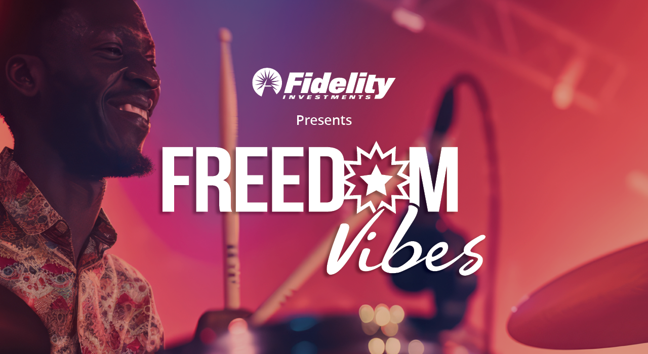 Happy man playing drums at a vibrant music event with colorful lighting, promoting freedom and good vibes.