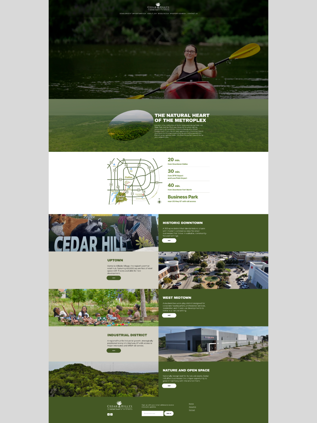 A woman kayaking on a lake surrounded by trees in a natural park setting.