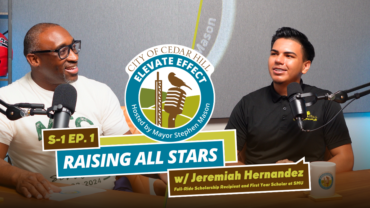 Two men sitting at a podcast table with microphones, having a conversation. One man is wearing glasses and a white t-shirt, the other is wearing a black polo shirt. A logo for 'City of Cedar Hill Elevate Effect' is in the background, and a sign reads 'Raising All Stars w/ Jeremiah Hernandez, Full-Ride Scholarship Recipient and First Year Scholar at SMU'.