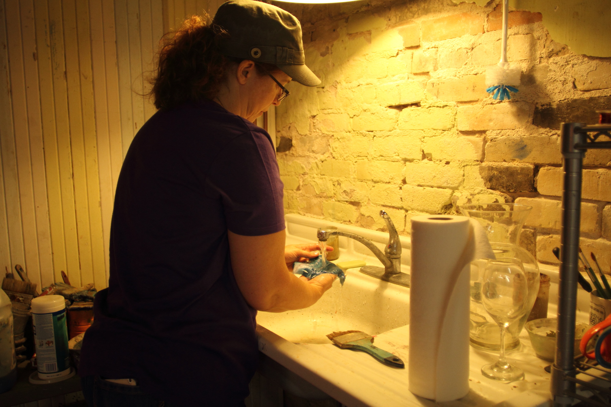 Sally washing out a cyanotype 