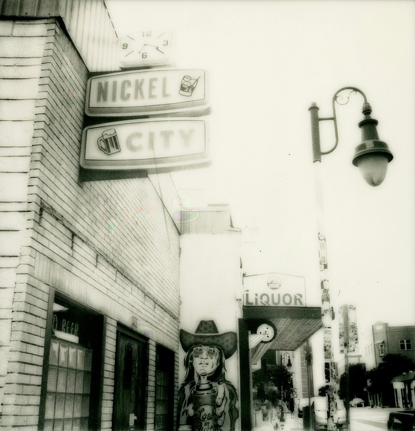 I finally made it to East Austin to photograph, and I hit a button without realizing it so a whole pack of film got way overexposed. I scanned them into my computer so I could salvage them and in spite of using a special holder all the Polaroids have