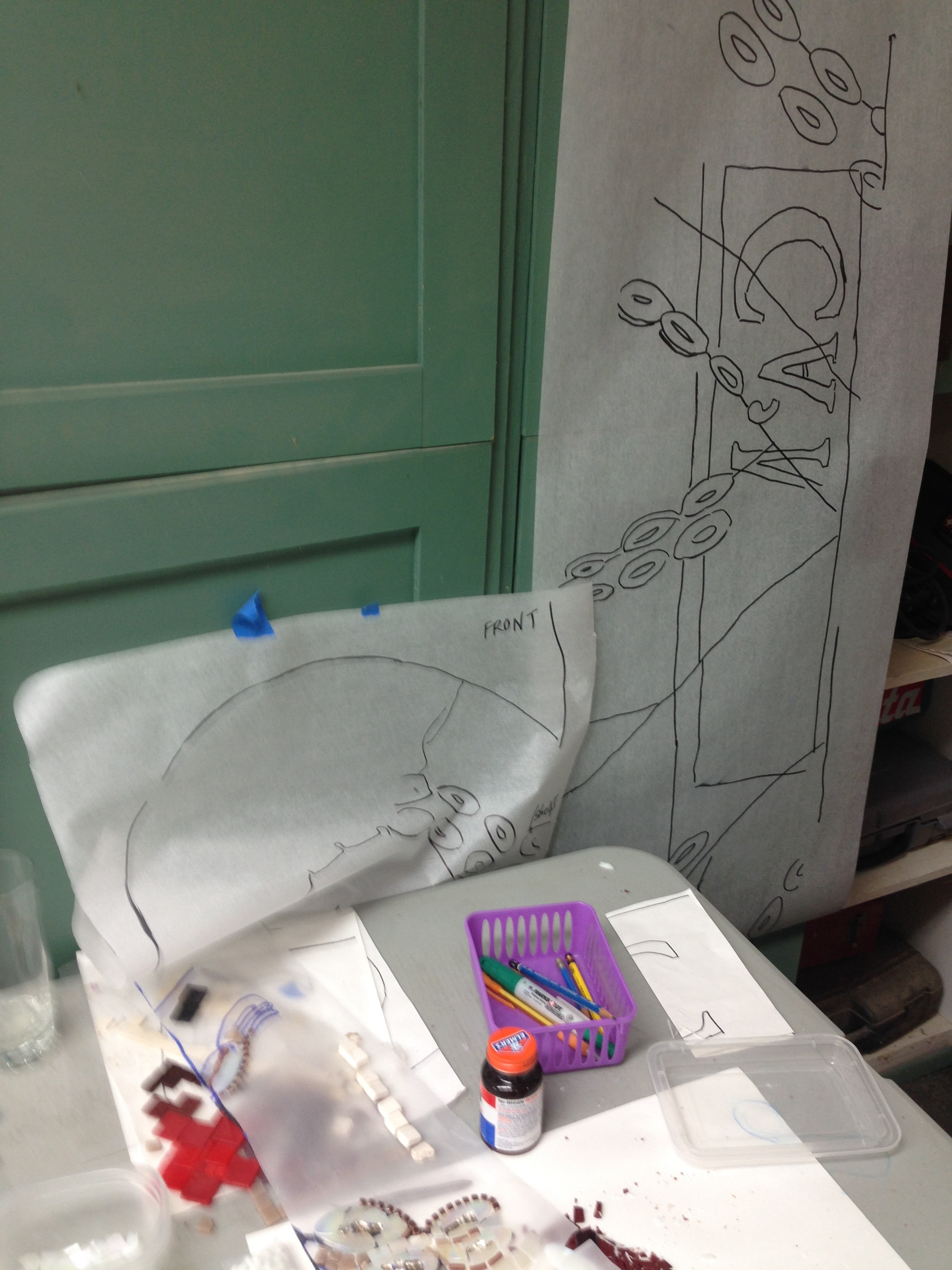 Tracing paper sheets waiting for tiles.