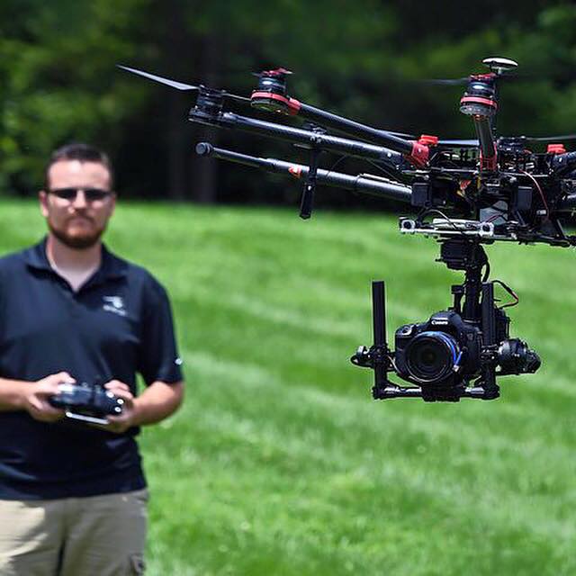 SnapRoll Media co-founder and pilot Spencer Valdez demonstrates flying an unmanned aerial vehicle outside the company's headquarters in Franklin, Tenn. on July 11, 2015. The aerial videography production company has been approved by the FAA to fly for commercial movie & TV production.