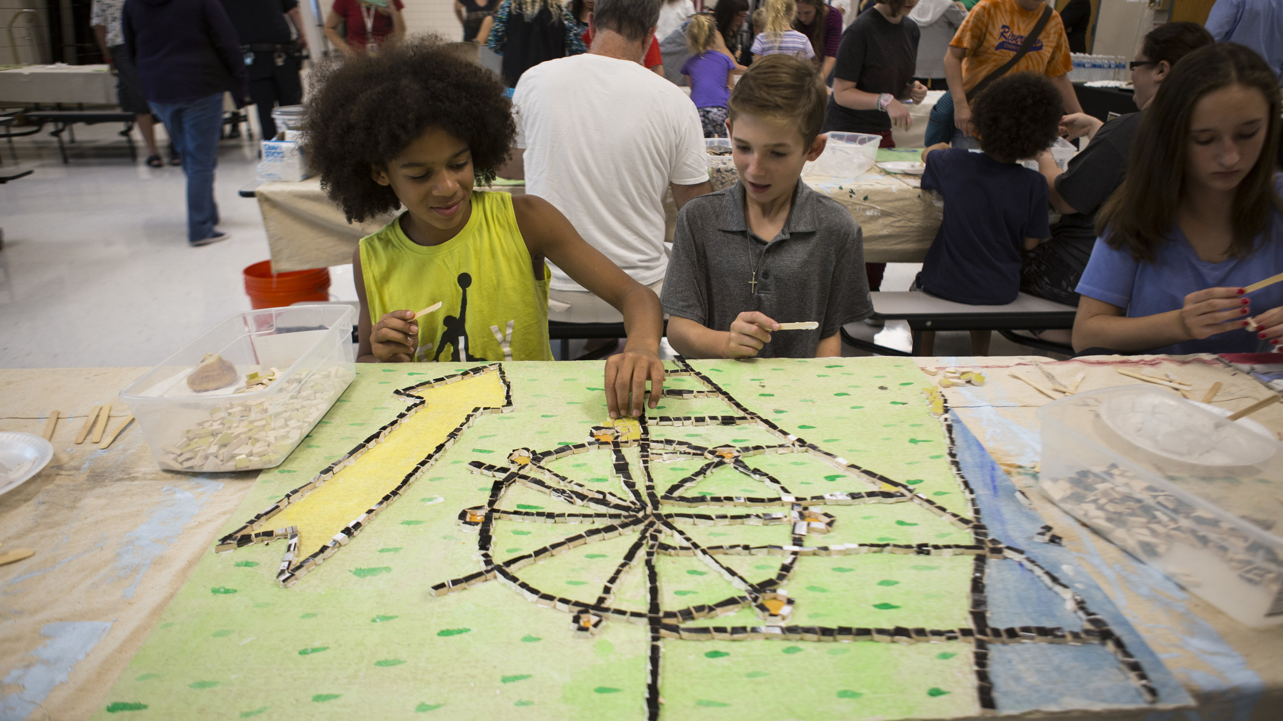 Riverview School District students help to put together a collaborative mosaic as part of an Artist-in-Residence program put on by Pittsburgh Filmmakers/Center for the Arts.